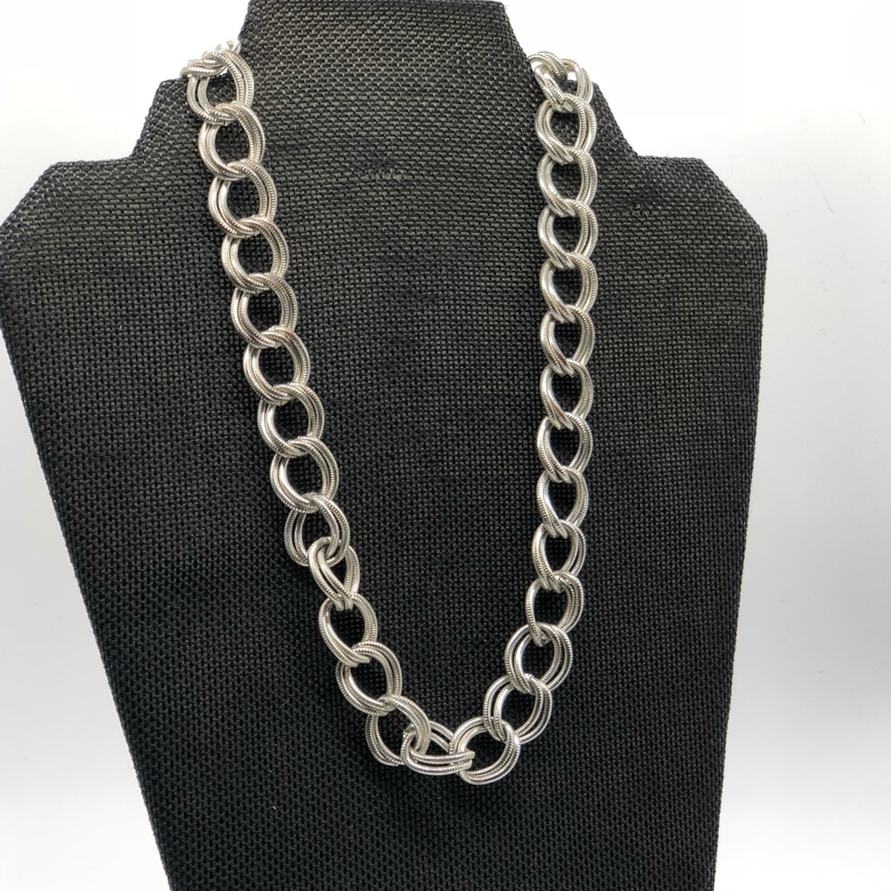 Silver textured chain link necklace.